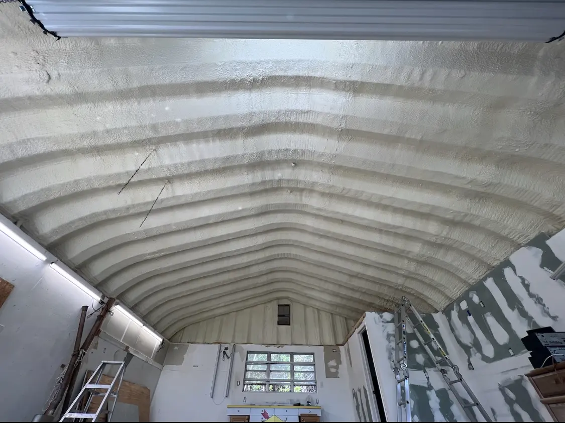 Spray polyurethane foam applied to the underside of a metal roof deck in South Abington